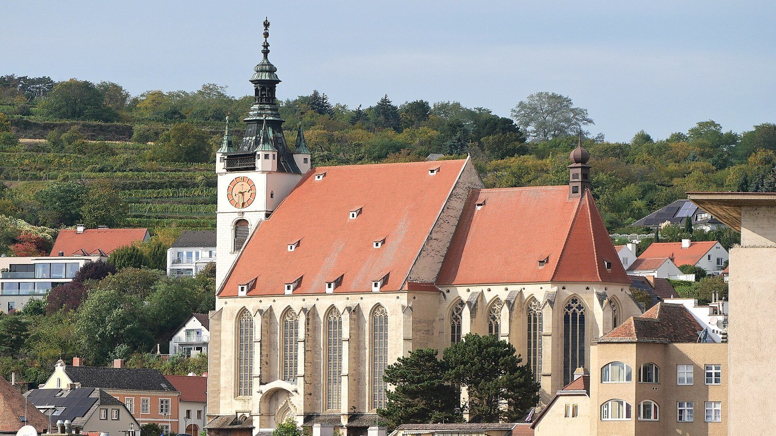 Piaristenkirche baroque church tower above the rooftops of Krems old town
