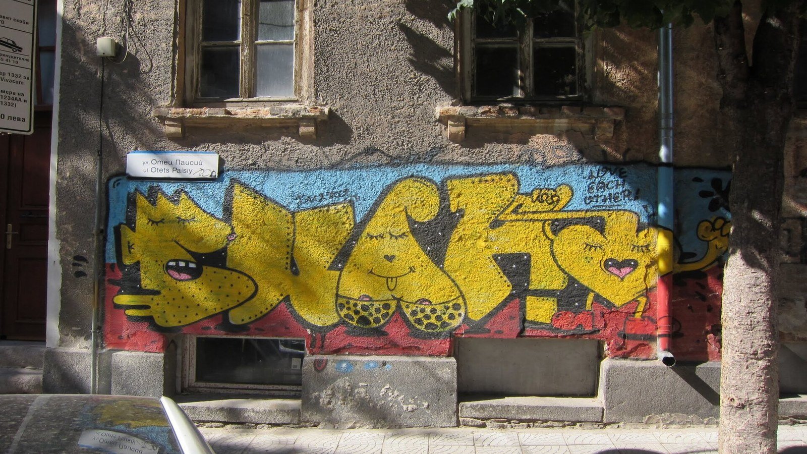 Large murals and street art on building facades in Plovdiv