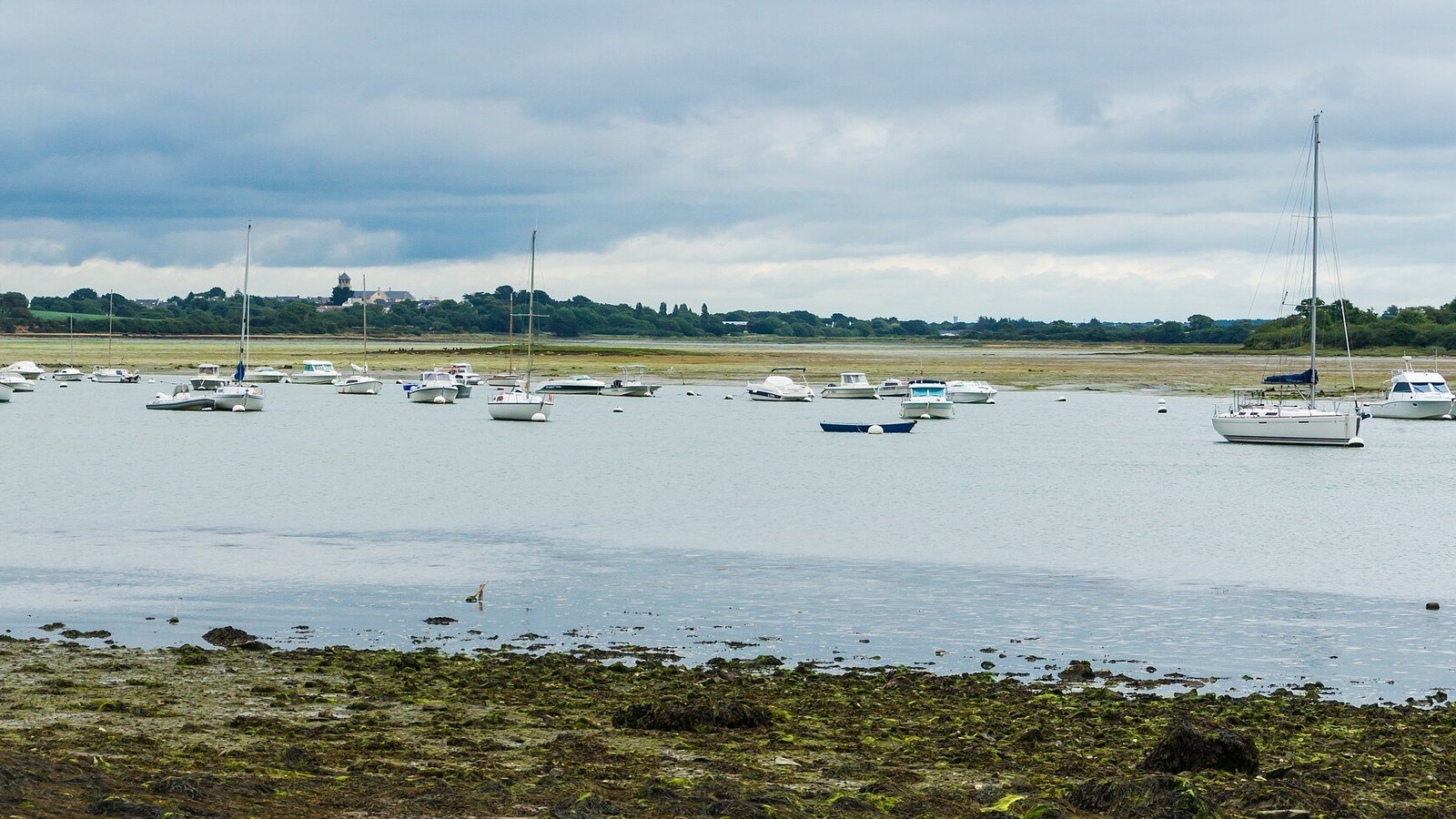 Sailboat crossing the Gulf of Morbihan among the islands