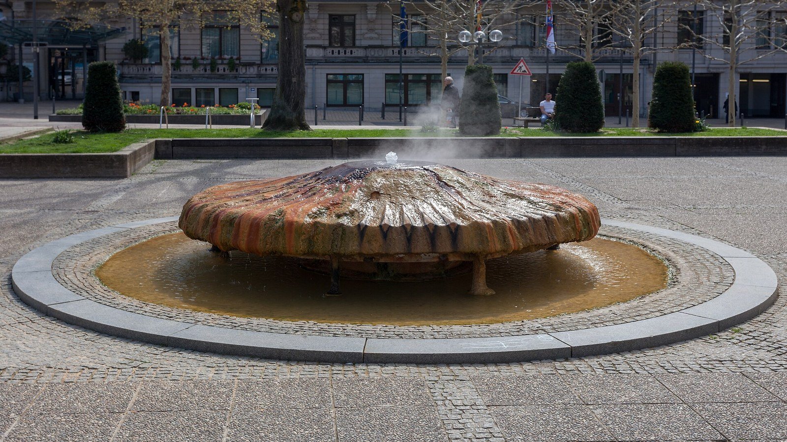 Kochbrunnen hot spring pavilion steaming on Kranzplatz in Wiesbaden